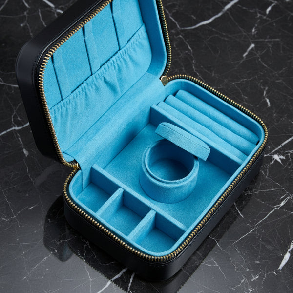 Blue jewelry case with a ring inside on a white background